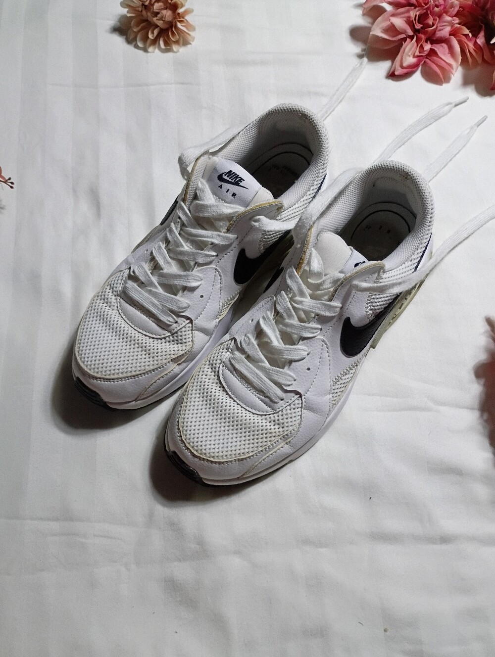 Nike White Sneakers with Black Swoosh for Women